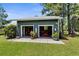 Exterior of a two-door garage featuring open doors, lawn care equipment, and convenient access at 1253 Culbreath Rd, Brooksville, FL 34602