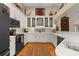 Bright, open kitchen with custom white cabinets, modern appliances, and ample counter space at 1253 Culbreath Rd, Brooksville, FL 34602