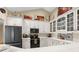 Well-equipped kitchen featuring white cabinets, modern appliances, and ample counter space at 1253 Culbreath Rd, Brooksville, FL 34602