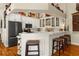 Stylish kitchen featuring white countertops, breakfast bar, and stainless steel appliances create a chic culinary space at 1253 Culbreath Rd, Brooksville, FL 34602