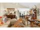 Cozy living room with neutral paint, plush seating, and open layout to the dining area at 1253 Culbreath Rd, Brooksville, FL 34602
