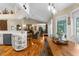 Open-concept living space featuring hardwood floors, recessed lights, and a kitchen counter bar at 1253 Culbreath Rd, Brooksville, FL 34602