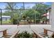 Spacious screened-in patio with a seating area and views of the wooded backyard at 1253 Culbreath Rd, Brooksville, FL 34602