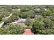 Aerial shot showcasing a single-story house, nestled among lush greenery and mature trees at 12722 Oak Tree Dr, Hudson, FL 34667