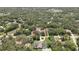 Aerial view of a property surrounded by mature trees, offering privacy and a sense of seclusion at 12722 Oak Tree Dr, Hudson, FL 34667