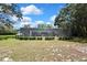 The screened-in pool area is conveniently accessible from the backyard, perfect for outdoor enjoyment at 12722 Oak Tree Dr, Hudson, FL 34667
