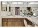 Bathroom vanity with a large mirror and decorative accents at 12722 Oak Tree Dr, Hudson, FL 34667