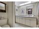 Bathroom with vanity, mirror, and soft decor at 12722 Oak Tree Dr, Hudson, FL 34667