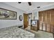 Neutral bedroom featuring a patterned bedspread, closet, and built-in features at 12722 Oak Tree Dr, Hudson, FL 34667