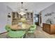 Inviting dining area with modern chandelier and built-in buffet at 12722 Oak Tree Dr, Hudson, FL 34667