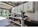 Organized garage space with ample cabinet storage and a workbench for projects at 12722 Oak Tree Dr, Hudson, FL 34667