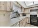 Kitchen with wood cabinets, laminate counters, stainless appliances, and a window at 12722 Oak Tree Dr, Hudson, FL 34667