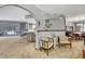 Open-concept living area with seamless flow to the outdoor pool area, highlighted by neutral carpet and arched entryways at 12722 Oak Tree Dr, Hudson, FL 34667