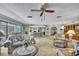 Open-concept living area flows into the kitchen with bar seating and plentiful light at 12722 Oak Tree Dr, Hudson, FL 34667