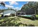 Lovely screened-in pool, perfect for relaxing or entertaining in this backyard oasis at 12722 Oak Tree Dr, Hudson, FL 34667