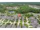 Aerial view showcases the neighborhood and lush green trees and landscaping at 12854 Rangeland Blvd, Odessa, FL 33556
