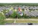 An aerial view of a well maintained home with lush landscaping and manicured lawn at 12854 Rangeland Blvd, Odessa, FL 33556