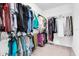 Walk-in closet with ample hanging space for clothes and accessories, perfect for organization and storage at 12854 Rangeland Blvd, Odessa, FL 33556