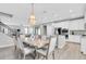 The dining area features an elegant chandelier, open to the kitchen and living area at 12854 Rangeland Blvd, Odessa, FL 33556