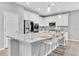 A modern kitchen with granite countertops, stainless steel appliances, and ample cabinet space at 12854 Rangeland Blvd, Odessa, FL 33556