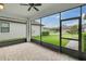 Enjoy the outdoors from this screened patio with brick pavers and a ceiling fan at 12854 Rangeland Blvd, Odessa, FL 33556