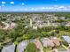 A stunning aerial view shows the home surrounded by mature trees, providing privacy and shade in a great location at 13627 Glaze Brook Dr, Hudson, FL 34667