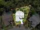 Aerial view of a beautiful home with a large, private lot surrounded by mature trees and lush landscaping at 13627 Glaze Brook Dr, Hudson, FL 34667