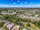 Beautiful aerial shot of property with mature trees in a Gathering-friendly neighborhood with picturesque blue skies at 13627 Glaze Brook Dr, Hudson, FL 34667