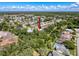 Aerial view of a charming home nestled in a lush, tree-filled neighborhood offering both privacy and natural beauty at 13627 Glaze Brook Dr, Hudson, FL 34667