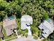 An aerial perspective highlights the lush greenery and landscaped yards of this residential neighborhood at 13627 Glaze Brook Dr, Hudson, FL 34667