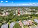 A stunning aerial view shows the home surrounded by mature trees, providing privacy and shade in a great location at 13627 Glaze Brook Dr, Hudson, FL 34667