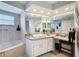 Bathroom featuring a bathtub with a shower, a toilet, and a sink vanity with mirror at 13627 Glaze Brook Dr, Hudson, FL 34667