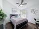 Modern bedroom featuring a large bed, contemporary furniture, and a window with natural light at 13627 Glaze Brook Dr, Hudson, FL 34667