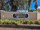 Barrington Woods community sign is surrounded by green shrubbery and mature trees, offering a welcoming entrance at 13627 Glaze Brook Dr, Hudson, FL 34667