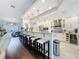 Modern kitchen with granite countertops, stainless steel appliances, and a large island with bar seating at 13627 Glaze Brook Dr, Hudson, FL 34667