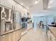 Contemporary kitchen showcasing stainless steel appliances, white cabinetry, and an open design for easy entertaining at 13627 Glaze Brook Dr, Hudson, FL 34667