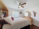 Comfortable main bedroom showcasing a ceiling fan and natural light from the window at 13627 Glaze Brook Dr, Hudson, FL 34667