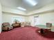 Relaxing rec room with a sofa, chairs, and poker table for leisure and entertainment at 13627 Glaze Brook Dr, Hudson, FL 34667