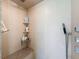 Close-up of tiled walk-in shower with a built-in seat and multiple shower heads at 13627 Glaze Brook Dr, Hudson, FL 34667