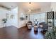Cozy sitting area featuring hardwood floors, bay window, and comfortable armchairs with ottomans at 13627 Glaze Brook Dr, Hudson, FL 34667