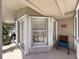Bright sunroom with multiple windows offering natural light and comfortable seating area at 13627 Glaze Brook Dr, Hudson, FL 34667