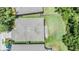 Aerial view of the house showcasing the roof, landscaping, and surrounding greenery at 1418 Halapa Way, Trinity, FL 34655