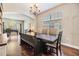 Inviting dining room featuring hardwood floors, a chandelier, and natural light at 1418 Halapa Way, Trinity, FL 34655