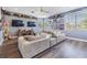 Spacious living room with hardwood floors, recessed lighting, and a ceiling fan at 1418 Halapa Way, Trinity, FL 34655