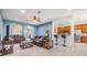 Bright and spacious living room featuring an open floor plan and tile flooring at 1418 Halapa Way, Trinity, FL 34655