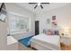 Bedroom with a large window with shutters, providing natural light and charm at 15413 Azra Dr, Odessa, FL 33556