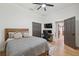 Well-lit bedroom with a full bed, closet, and access to bathroom at 15413 Azra Dr, Odessa, FL 33556