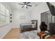 Cozy bedroom featuring a full bed, closet, and desk at 15413 Azra Dr, Odessa, FL 33556
