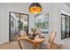 Bright dining area with views of the pool and sliding glass doors to the lanai at 15413 Azra Dr, Odessa, FL 33556