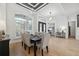 Tasteful dining room featuring an elegant chandelier, shuttered window, and access to other living areas at 15413 Azra Dr, Odessa, FL 33556